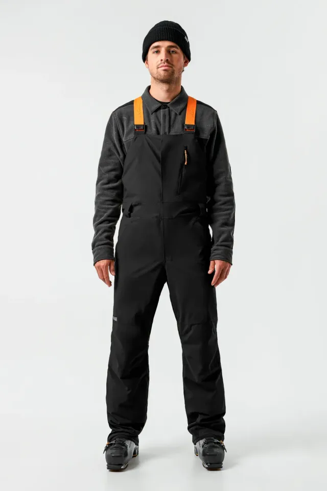 Orage Leeds salopette ski noire homme isolée